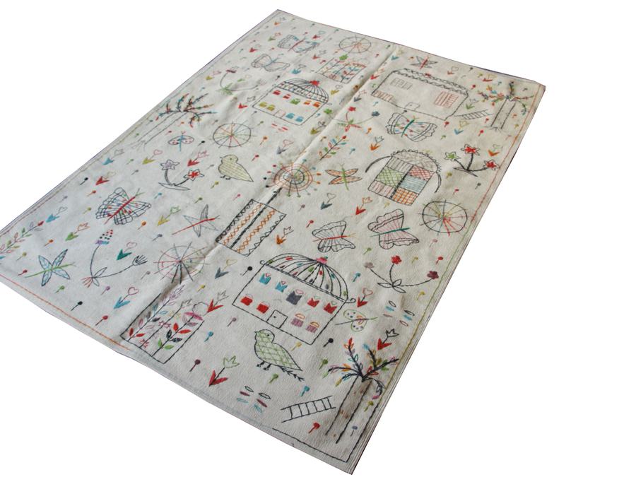 Custom hand-embroidered flatweave rug in embroidered, woven to order by Rug Gossips in Lahore