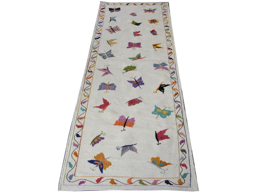 Custom hand-embroidered flatweave rug in hooked runner, woven to order by Rug Gossips in Lahore