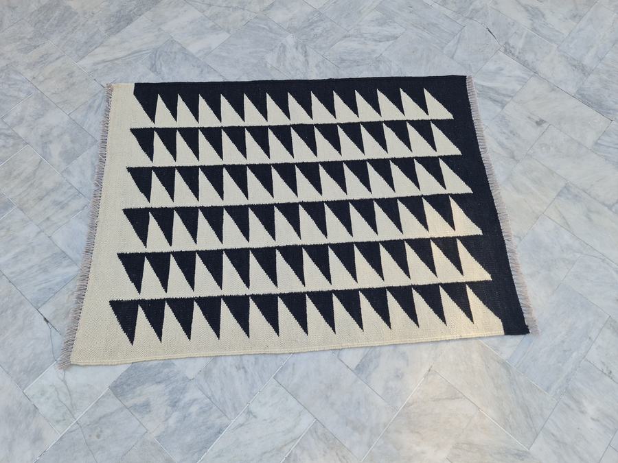 Custom flatweave kilim rug in black and white dhurrie, woven to order by Rug Gossips in Lahore