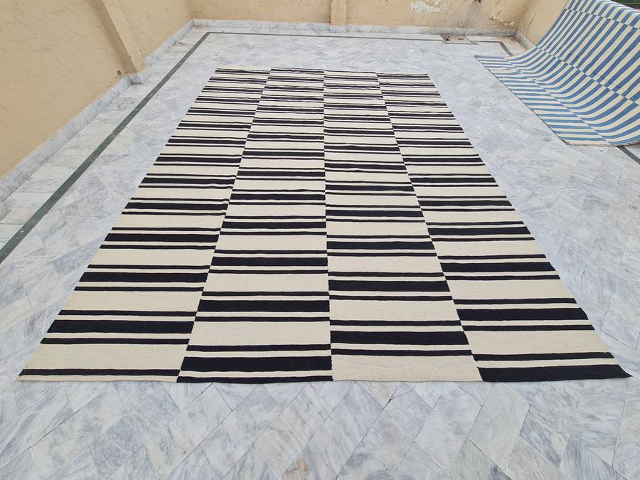 Custom flatweave kilim rug in black and white striped, woven to order by Rug Gossips in Lahore