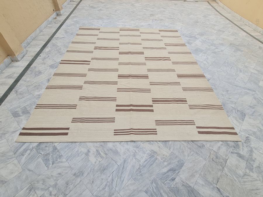 Custom flatweave kilim rug in brown and ivory striped, woven to order by Rug Gossips in Lahore