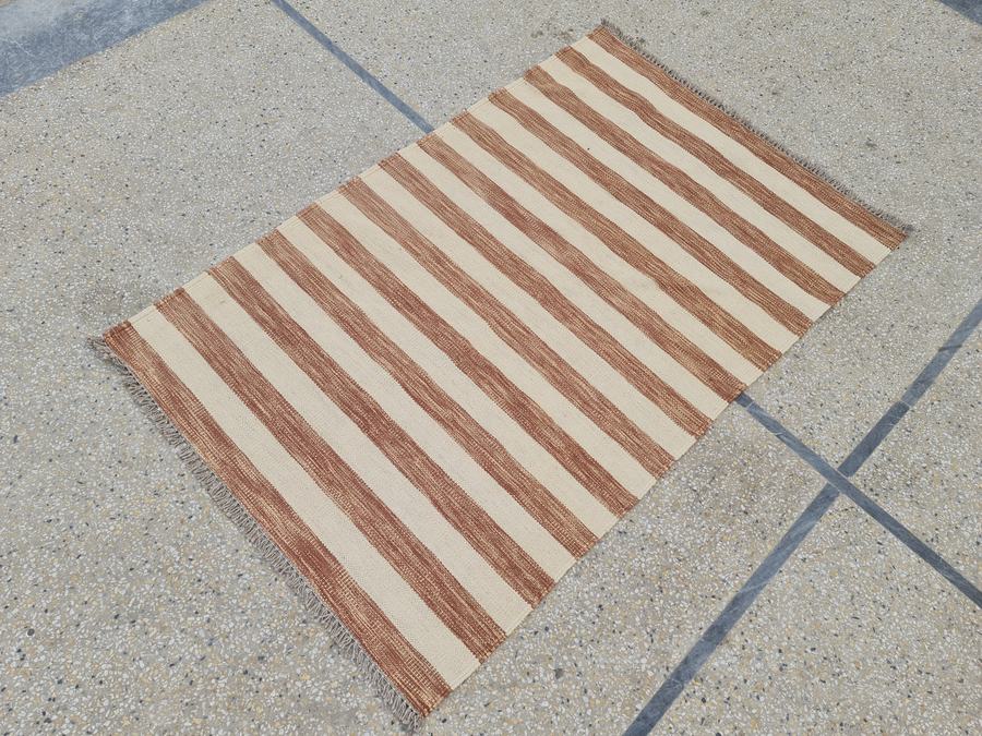 Custom flatweave kilim rug in brown and white ivory beige, woven to order by Rug Gossips in Lahore