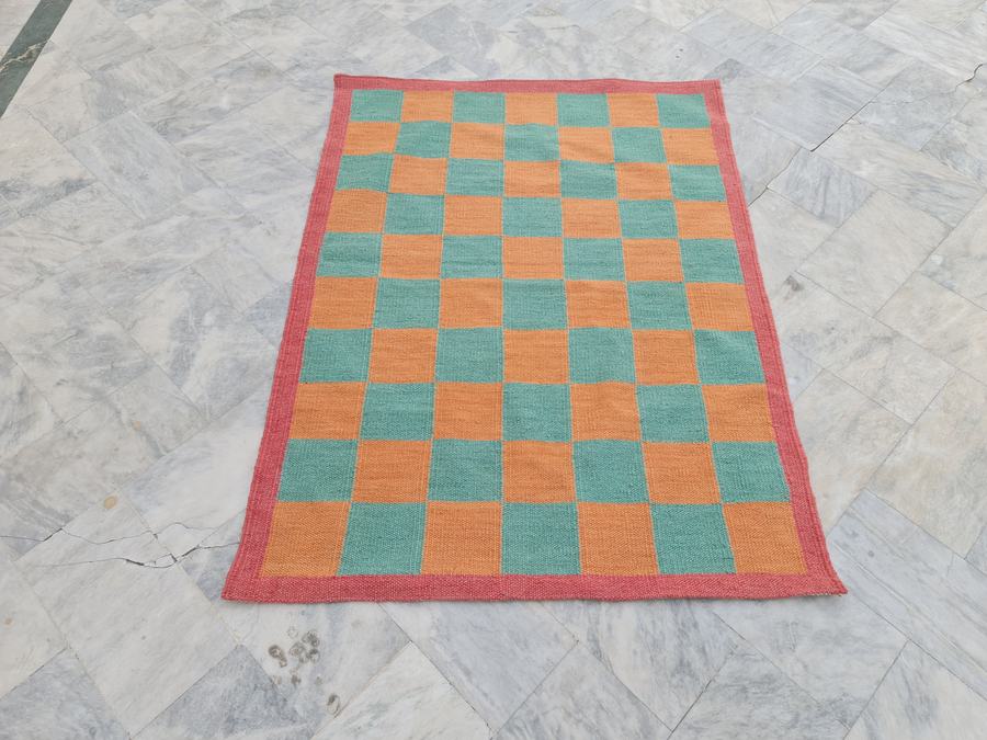 Custom flatweave kilim rug in checkered, woven to order by Rug Gossips in Lahore