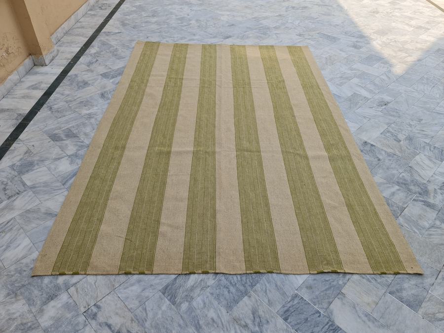 Custom flatweave kilim rug in green and ivory flatweave, woven to order by Rug Gossips in Lahore