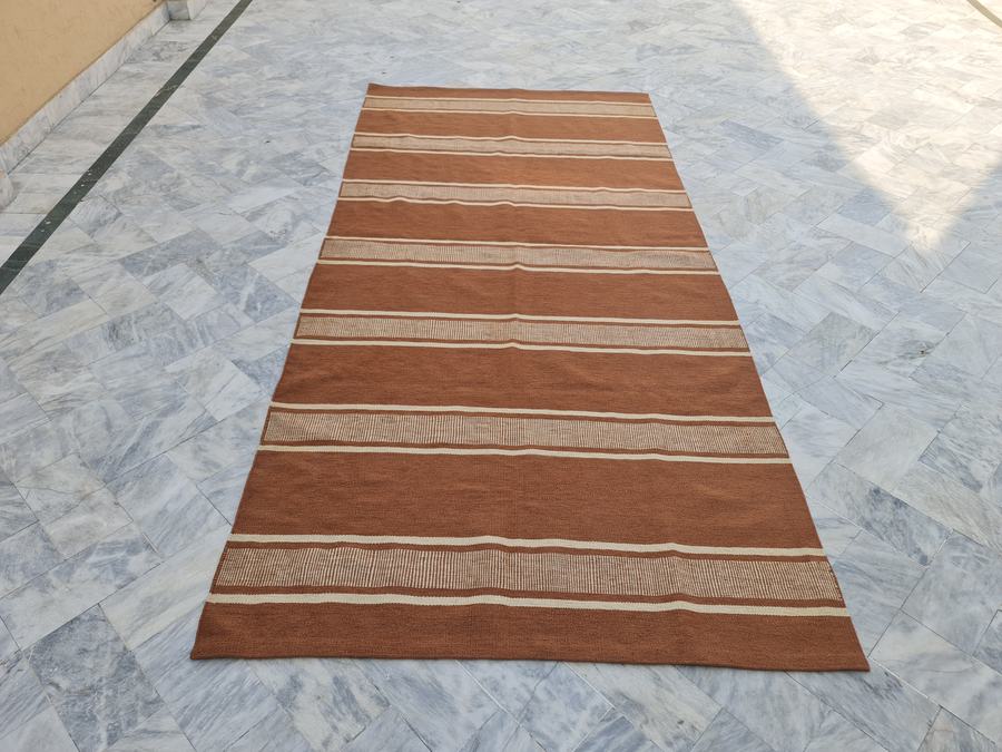 Custom flatweave kilim rug in living room dhurrie, woven to order by Rug Gossips in Lahore