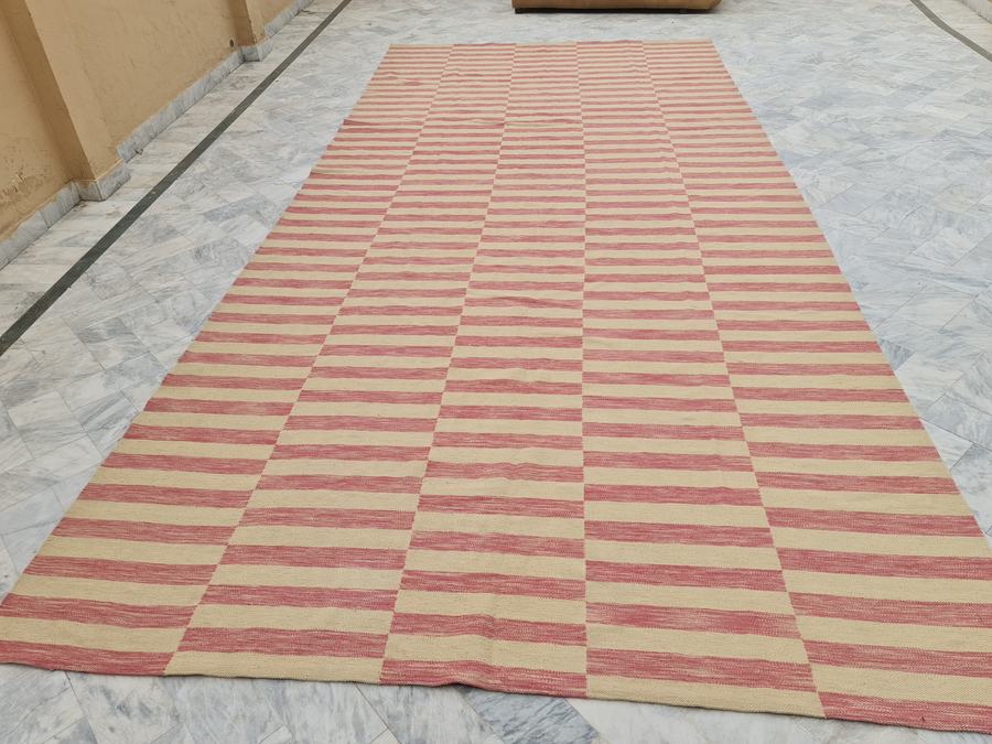 Custom flatweave kilim rug in pink and cream, woven to order by Rug Gossips in Lahore