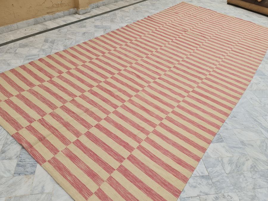 Custom flatweave kilim rug in pink and ivory, woven to order by Rug Gossips in Lahore