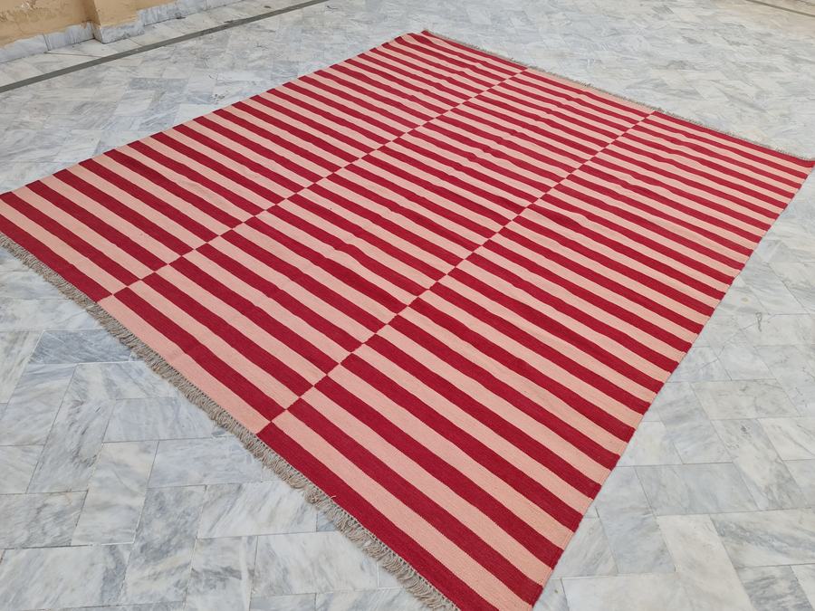 Custom flatweave kilim rug in pink and red custom kilim, woven to order by Rug Gossips in Lahore