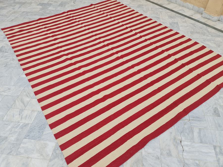 Custom flatweave kilim rug in red and cream striped kilim, woven to order by Rug Gossips in Lahore