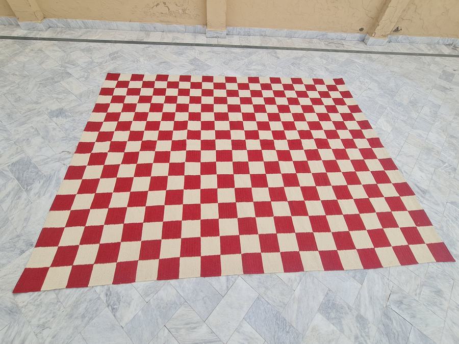 Custom flatweave kilim rug in red and white checkered, woven to order by Rug Gossips in Lahore