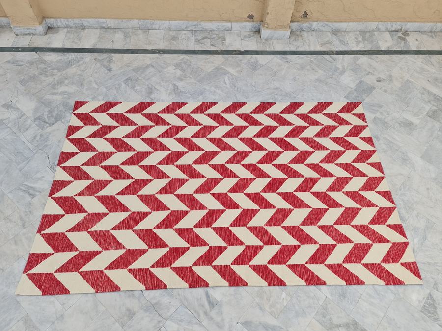 Custom flatweave kilim rug in red and white, woven to order by Rug Gossips in Lahore