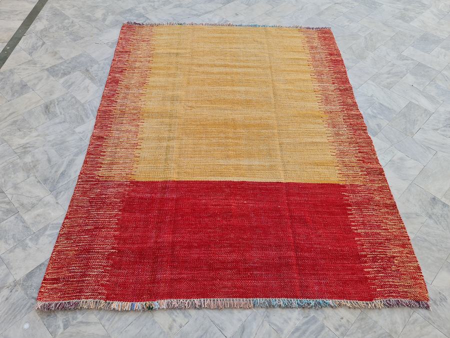 Custom flatweave kilim rug in yellow and red, woven to order by Rug Gossips in Lahore