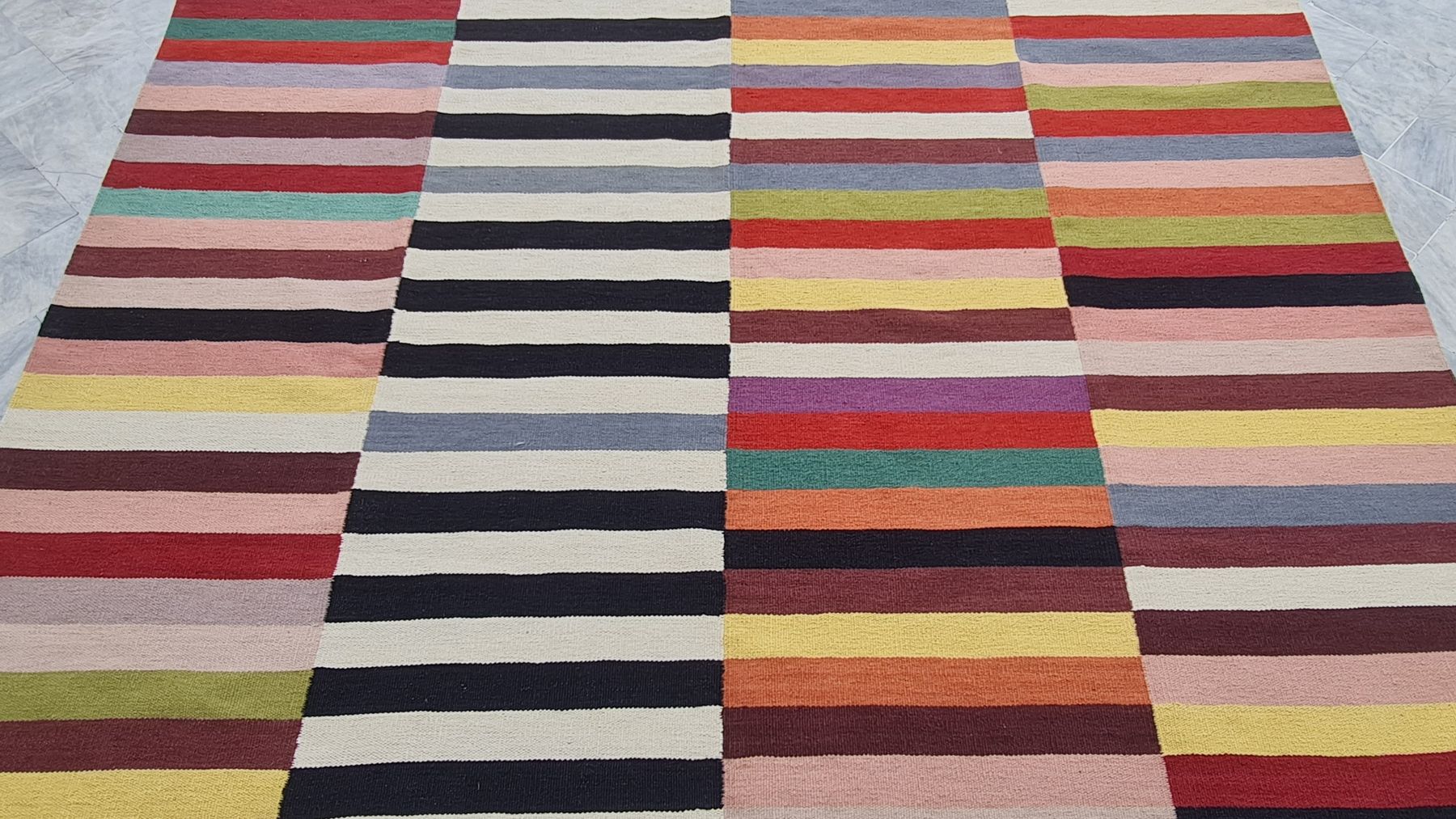 Detail of a custom flatweave rug woven by Rug Gossips in Lahore