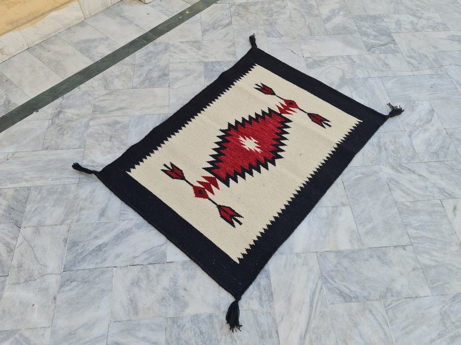 Custom Southwestern Navajo-style flatweave rug in red black white navajo, woven to order by Rug Gossips in Lahore